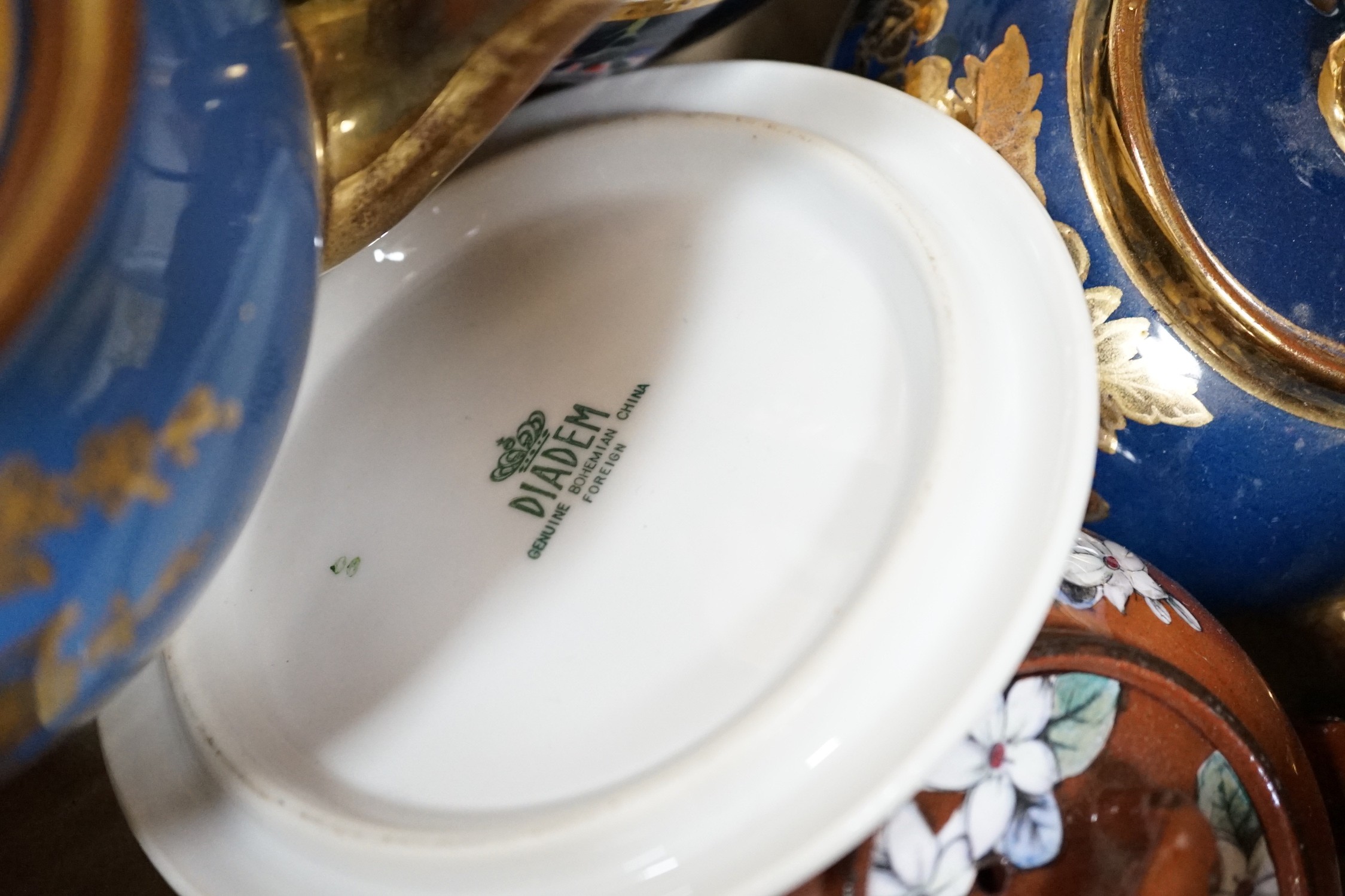 A quantity of various teapots including Belleek, Japanese Satsuma etc.